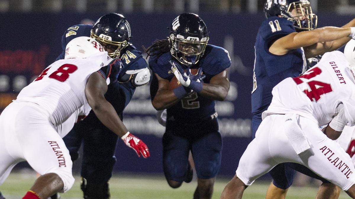 FIU running back Anthony Jones (2) picks up yards during the Panthers game against FAU on Saturday, Nov. 3, 2018. It was Jones first game back.
