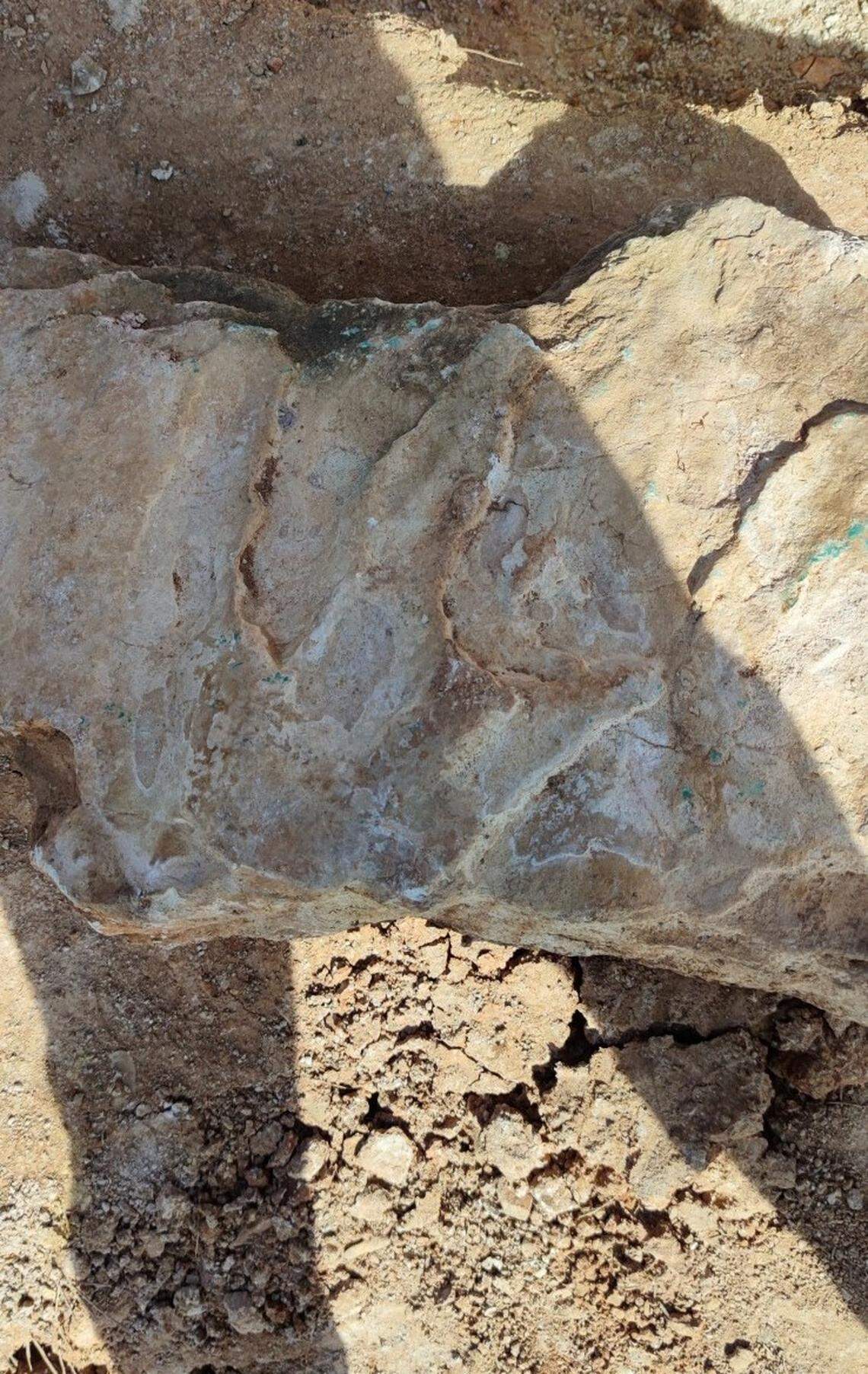 Photos show the stone slap at the convent site.