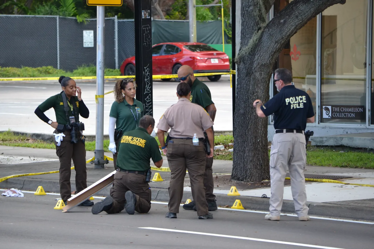 Florida Department of Law Enforcement and Miami-Dade County deputies investigate a crime scene where an officer allegedly shot someone in the village of Miami Shores on Sunday, June 21, 2026.