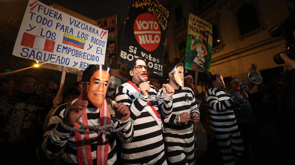 Demonstrators take part in a march against corruption in Lima, Peru in 2018.