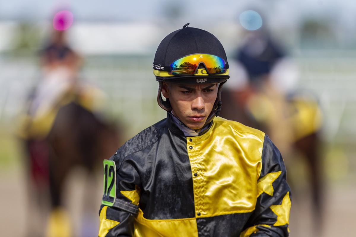 Jose Ortiz (12) walks back to the jockey’s locker room after competing in a race at Gulfstream Park in Hallandale Beach, Florida, on Wednesday, Jan. 9, 2019. Ortiz and his brother Irad are regarded as two of the best jockeys in the nation.