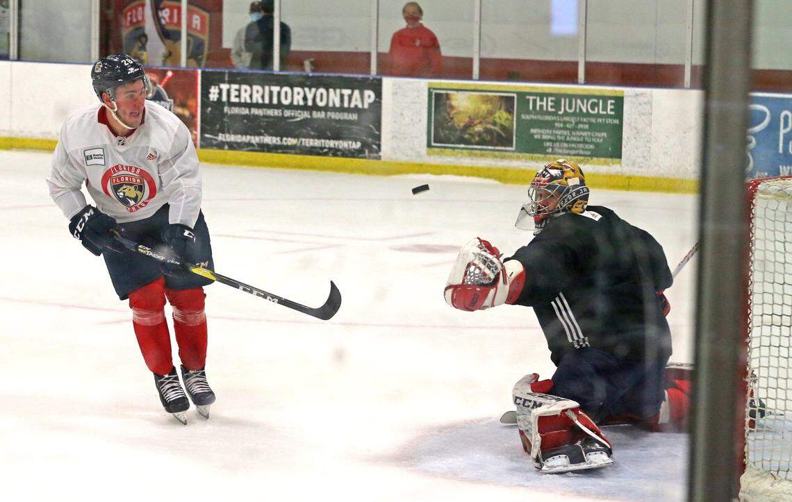 Florida Panthers goalie Philippe Desrosiers as Aleksi Saarela (28) flips the puck at the net at their practice facility in Coral Springs, Florida, July 15, 2020.
