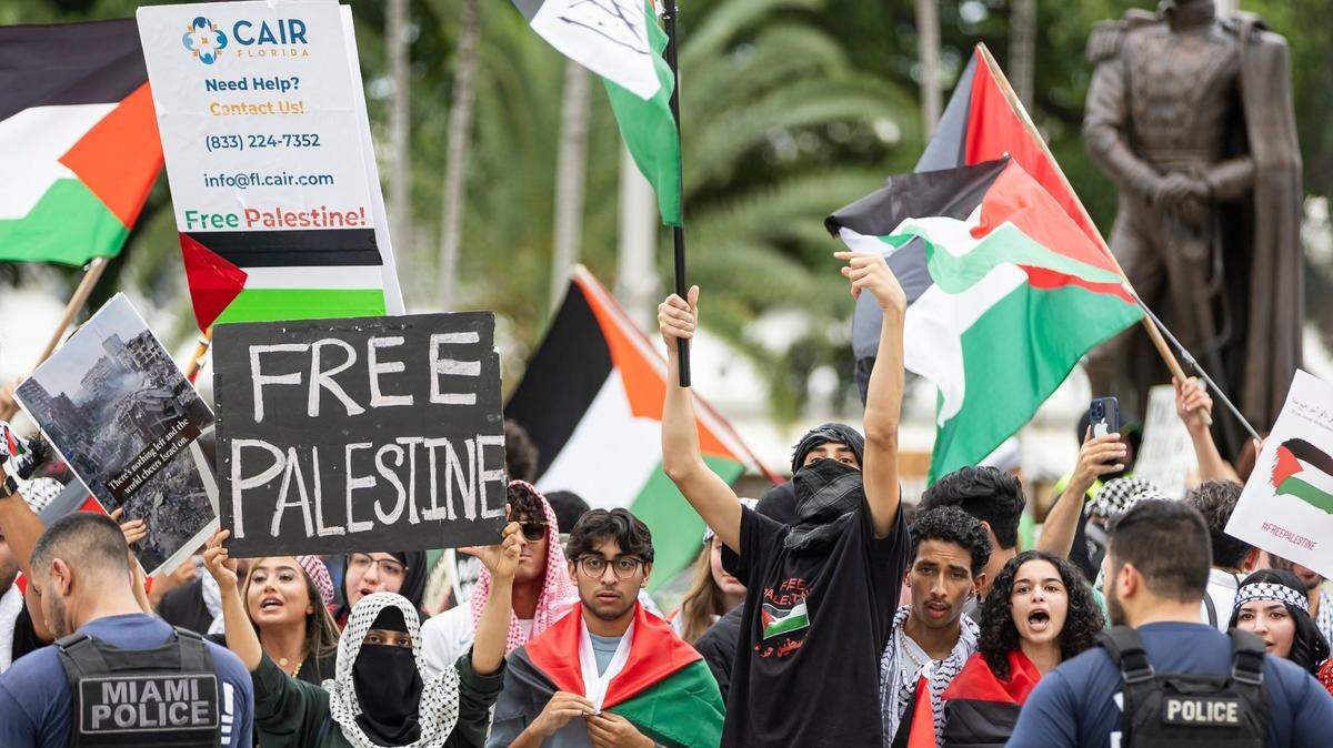 FILE - Activists chant during a pro-Palestine rally near the Torch of Friendship on Friday, Oct. 13, 2023, in downtown Miami, Fla.