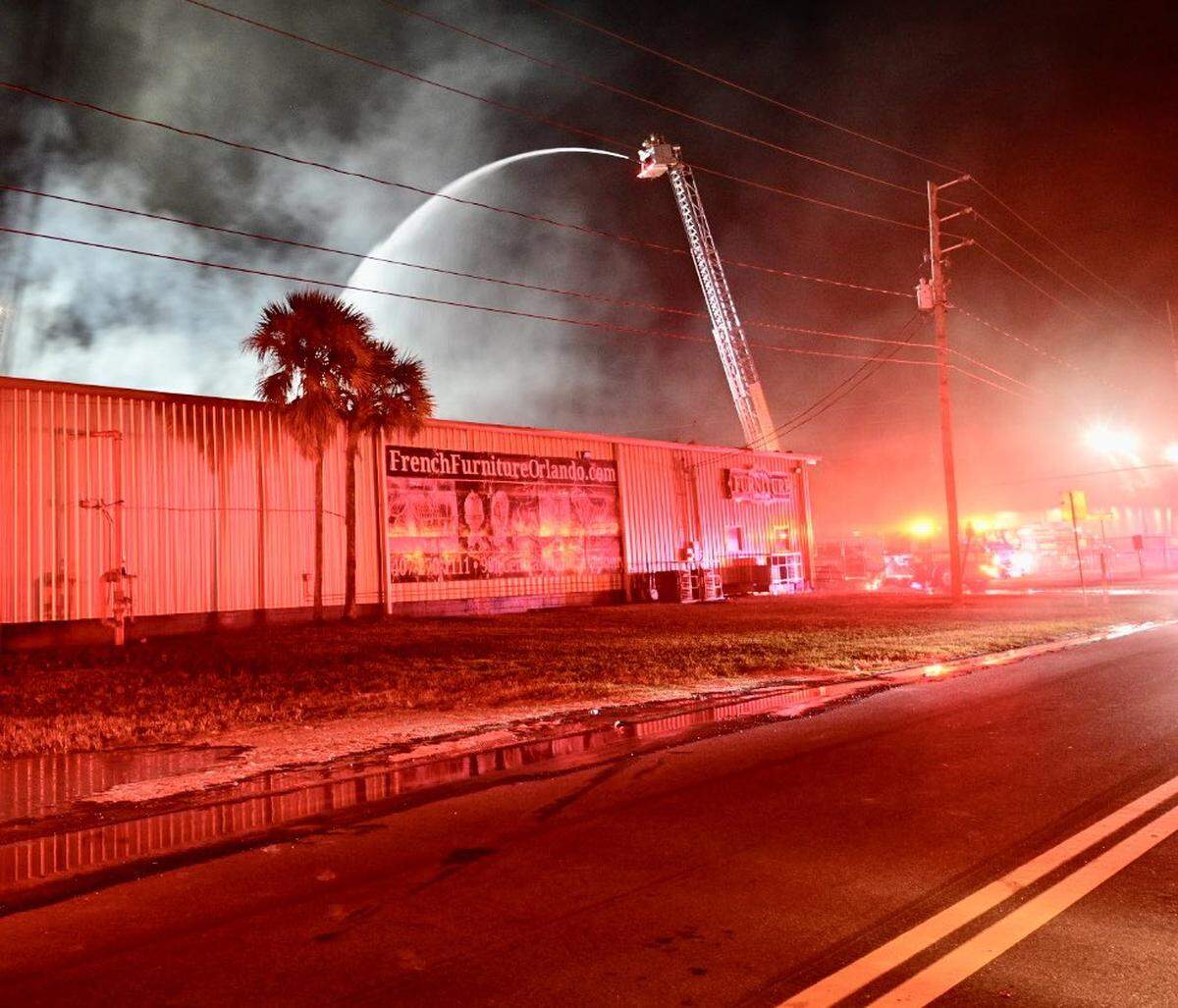 Orange County Fire Rescue fire rescue workers fight the Dec. 1 fire at the Magic in the Sky fireworks warehouse.