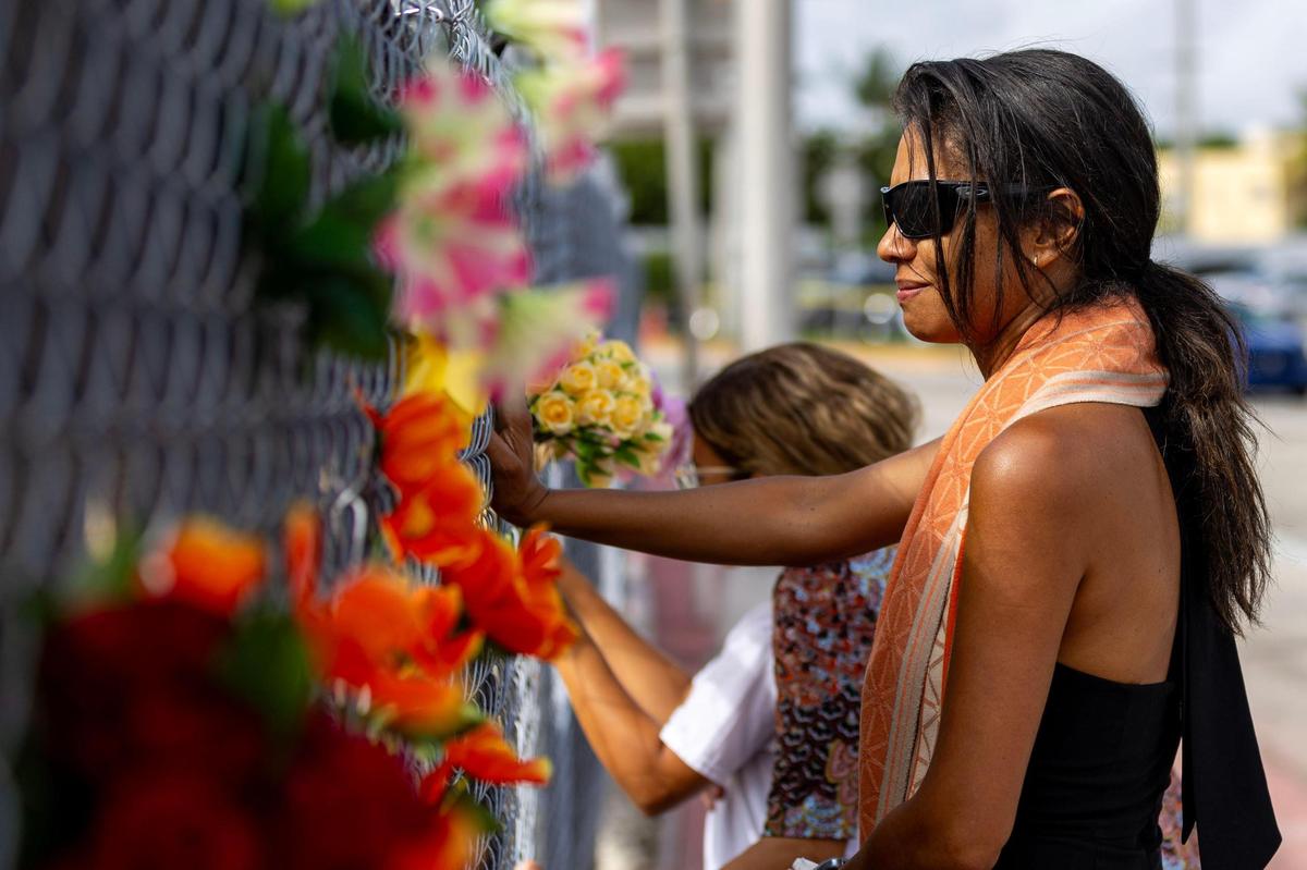 People visit the site of the Champlain Towers South building collapse before the Second Annual Remembrance Ceremony at Veterans Park on Saturday, June 24, 2023, in Surfside, Florida.
