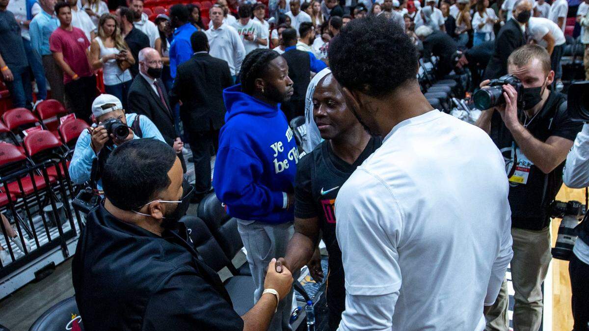 Miami Heat forward Udonis Haslem introduces DJ Khaled, left, to Thomas Raynard James, who was falsely convicted of first-degree murder on Jan. 11, 1991, and sentenced to life behind bars, after Game 1 of a second round NBA Eastern Conference semifinal playoff series against the Philadelphia 76ers at FTX Arena in Miami, Florida, on Monday, May 2, 2022.
