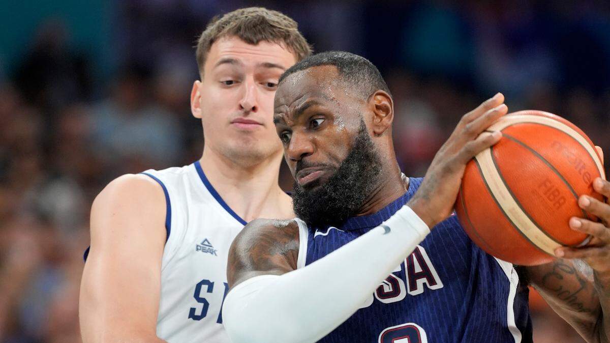 United States guard Lebron James (6) drives against Serbia power forward Nikola Jovic (5) in the first quarter during the Paris 2024 Olympic Summer Games at Stade Pierre-Mauroy.