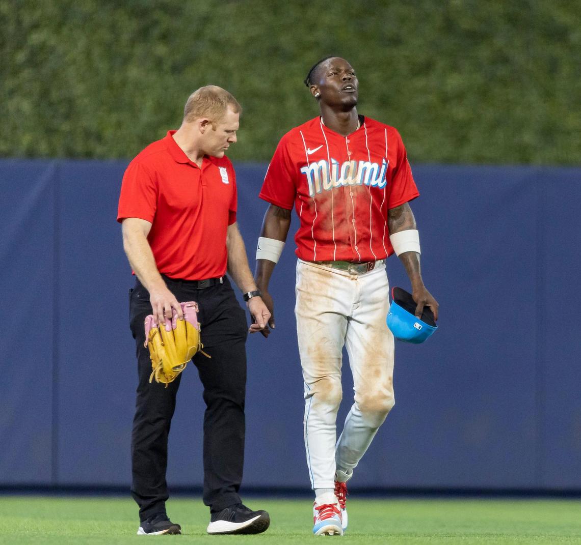 Miami Marlins center fielder Jazz Chisholm Jr. (2) reacts after hurting himself after a play against the Cincinnati Reds in the eighth inning of an MLB game at loanDepot park on Saturday, May 13, 2023, in Miami, Fla.