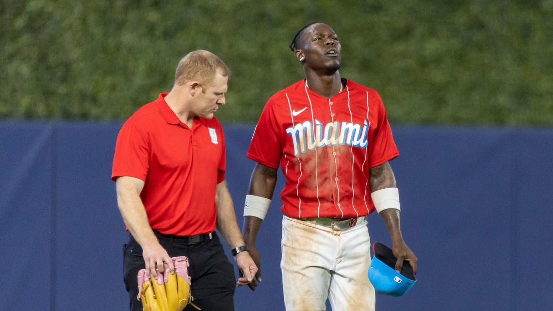 Miami Marlins center fielder Jazz Chisholm Jr. (2) reacts after hurting himself after a play against the Cincinnati Reds in the eighth inning of an MLB game at loanDepot park on Saturday, May 13, 2023, in Miami, Fla.