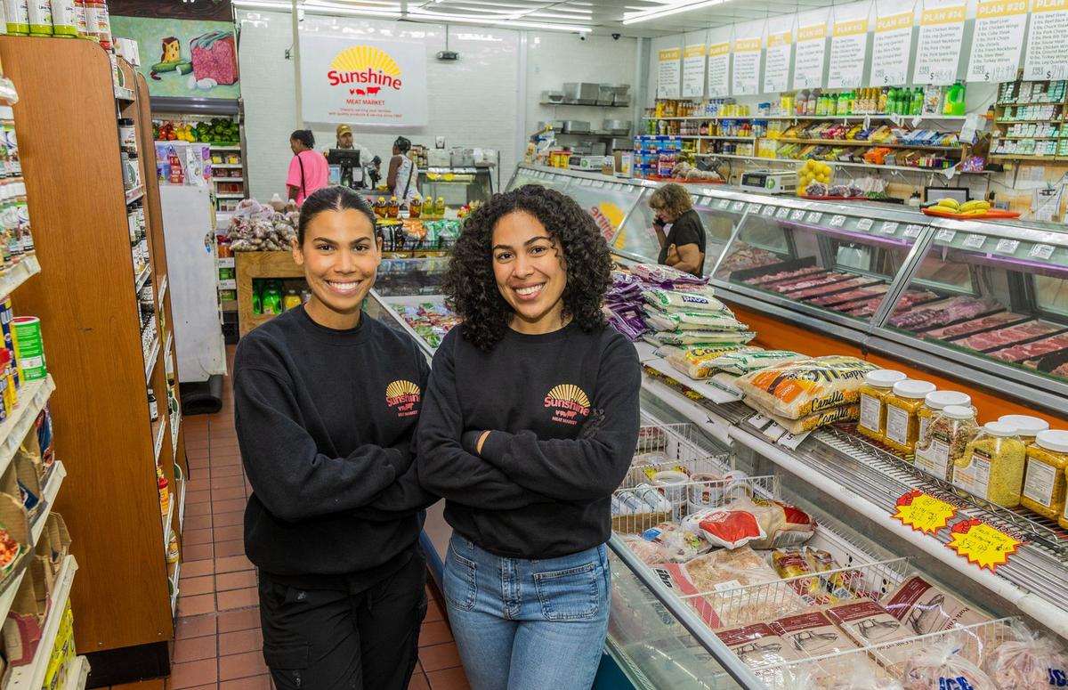 Sisters Karissa and Vanessa Disla, posed at her family’s Sunshine Meat Market in Miami Gardens founded by their father Rafael Disla, who is visiting their grandfather who is turning in Dominican Republic for Father’s Day, on Wednesday, June 05, 2024.