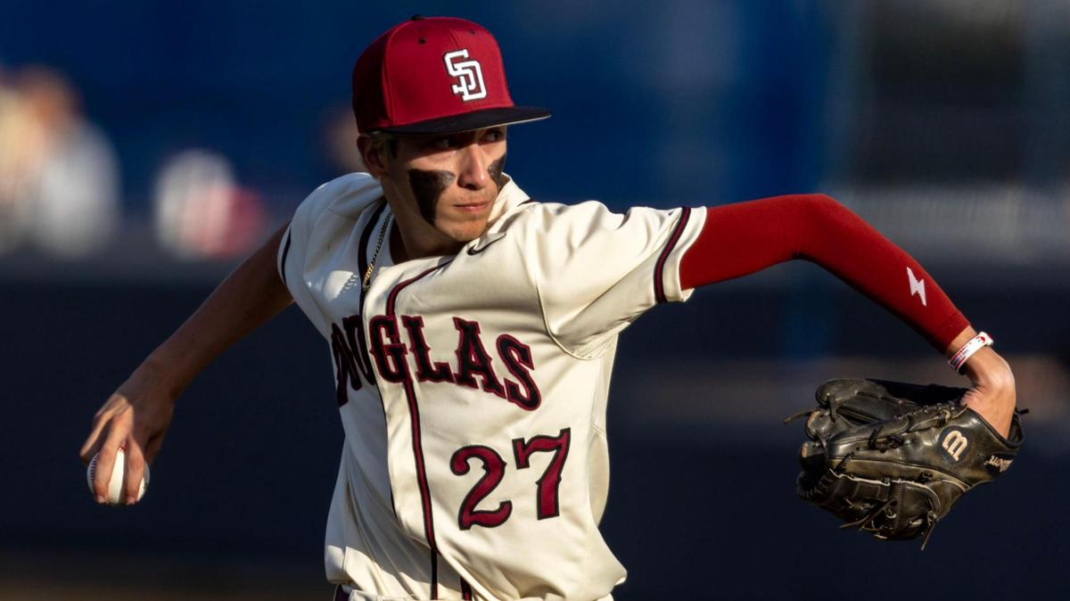 Marjory Stoneman Douglas pitcher Jayden Dubanewicz (27) pitches during the second inning of a game against Columbus at Columbus High School in Miami, Florida, on Friday, March 24, 2023.