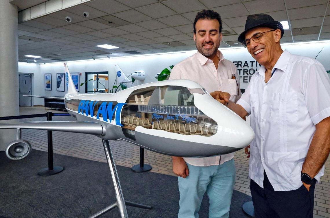 Armando Martinez, at right, vice president of flight operations at Miami Air International, checks out a model of a Pan American Airways 747 jet named after founder Juan Trippe with Tomas Romero, general manager at World Atlantic Airlines. The model is on display at the Pan Am Flight Academy building at Miami International Airport.