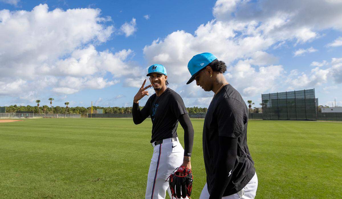 Miami Marlins pitcher Eury Pérez (39) and teammate pitcher Edward Cabrera (27) walk on the field during spring training workouts for pitchers and catchers at Roger Dean Stadium in Jupiter, FL, on Wednesday, Feb. 12, 2025.