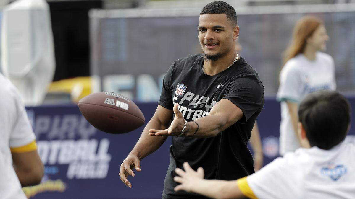 NFL Draft prospect Alabama defensive back Minkah Fitzpatrick tosses the ball during a Play Football Clinic Wednesday, April 25, 2018, in Arlington, Texas. The 2018 NFL Draft begins Thursday.