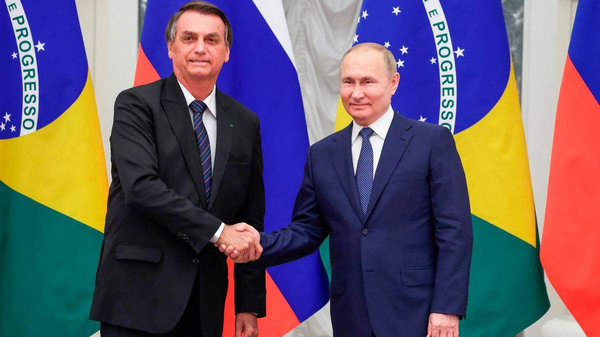 Russian President Vladimir Putin, right, and Brazil’s President Jair Bolsonaro shake hands after a joint news conference following their talks in the Kremlin in Moscow, Russia, Wednesday, Feb. 16, 2022.