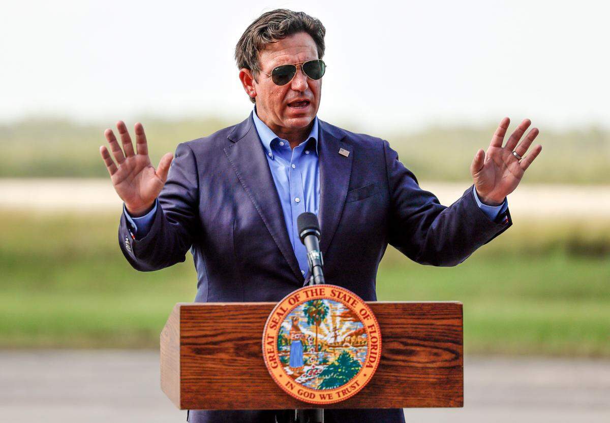 Governor Ron DeSantis speaks to reporters during a press conference on the airplane runway of Alligator Alcatraz in Ochopee , Florida on Friday, July 25, 2025. 