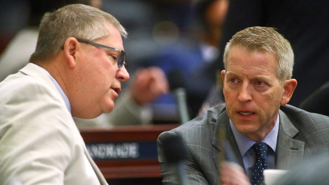 Rep. Paul Renner, R-Palm Coast, right, confers with Rep. Chuck Brannan III, R-Macclenny, in the Florida House of Representatives during the recent special session about property insurance, Wednesday, May 25, 2022, at the Capitol in Tallahassee, Fla.