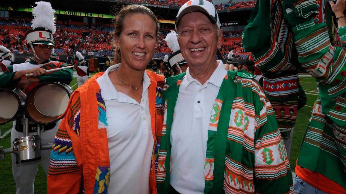 Ernie Yaroshuk, who died at the age of 81 on Friday, Dec. 16, 2022, is shown with his daughter Paige at Hard Rock Stadium several years ago. The two form the only father-daughter duo in the University of Miami Sports Hall of Fame.
