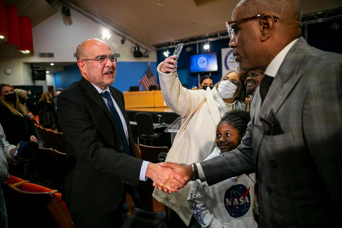 Jose Dotres, left, is congratulated by Miami-Dade School Board Vice Chair Dr. Steve Gallon III after being selected by the Miami-Dade School Board as the next superintendent in a 6-3 vote on Monday, January 24, 2022.