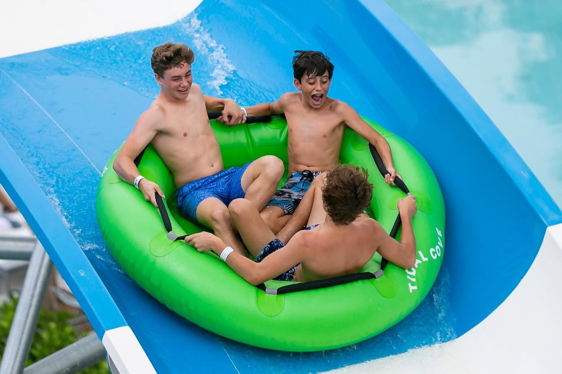 Guests ride down a waterslide at Tidal Cove Waterpark in Aventura’s JW Marriott Miami Turnberry Resort & Spa on Saturday, June 8, 2019. The park has seven water slides, a FlowRider surfing pool and a lazy river among other amenities.