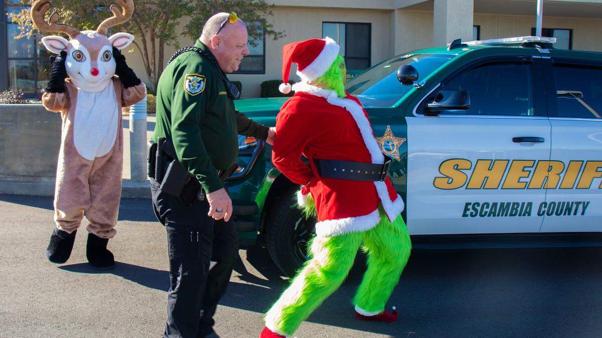 The Grinch being taken into custody in Florida