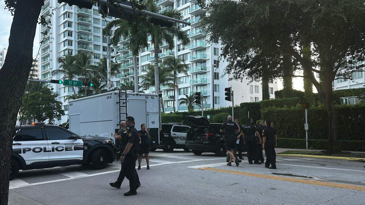 Miami Beach police shut down streets to investigate reports of a man with a rifle outside a condo, causing traffic delays.