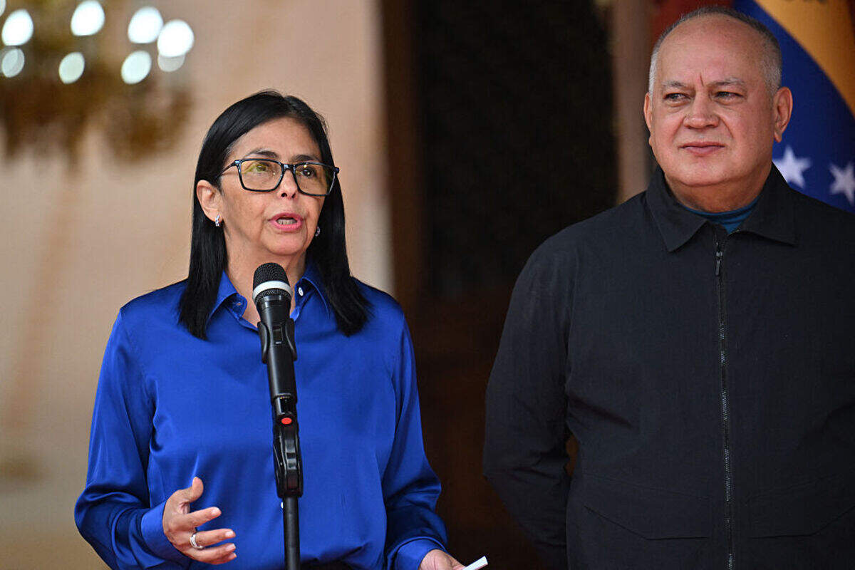 Venezuela's interim President Delcy Rodriguez speaks next to Interior Minister Diosdado Cabello during a press conference at the Miraflores Presidential Palace in Caracas on Jan. 14, 2026.