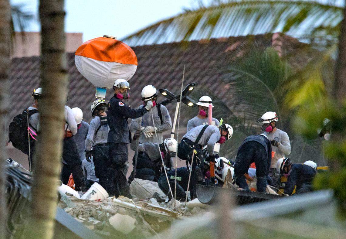 Search and rescue personnel search for survivors through the rubble at the Champlain Towers South Condo in Surfside, Florida, Wednesday, June 30, 2021. The apartment building partially collapsed on Thursday, June 24.