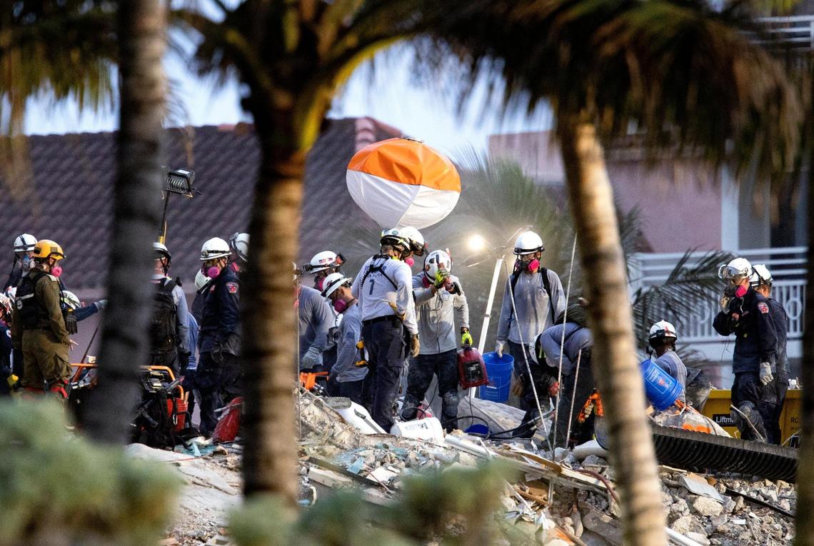 Search and rescue personnel search for survivors through the rubble at the Champlain Towers South in Surfside, Florida, Wednesday, June 30, 2021. The condo building partially collapsed on Thursday, June 24.