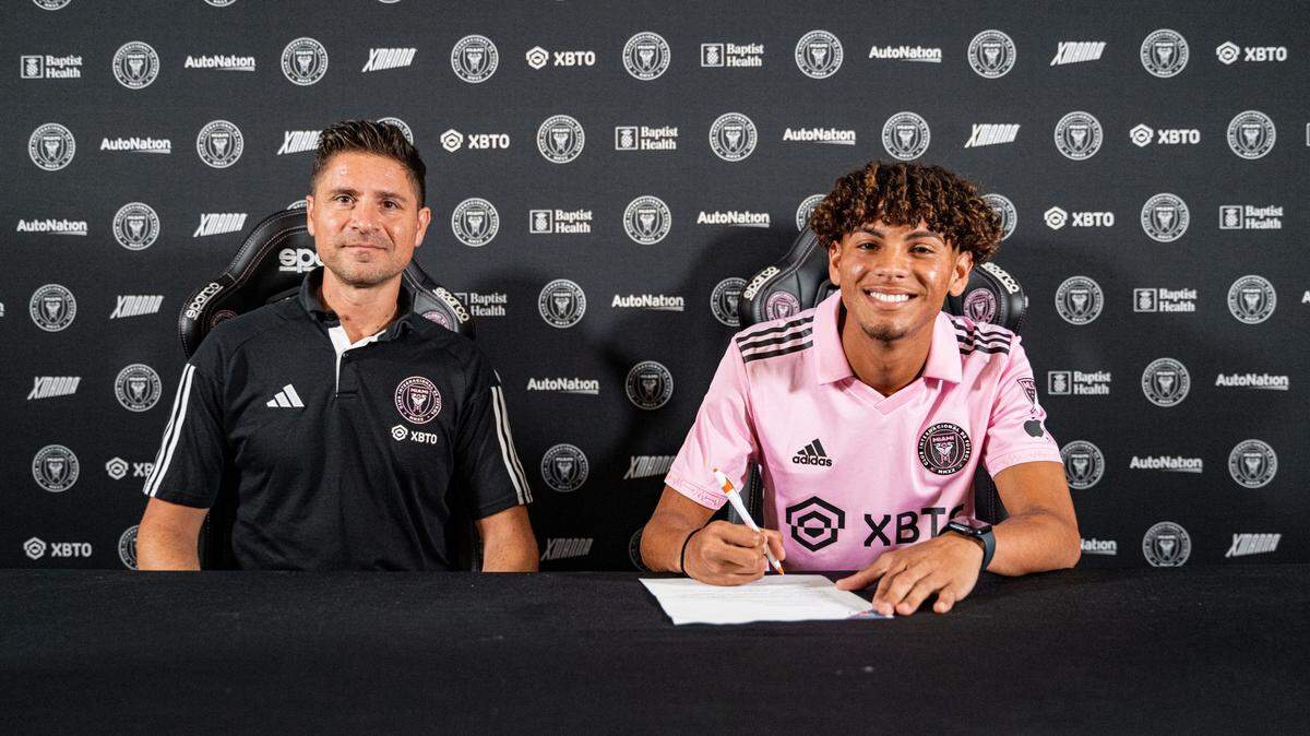 Inter Miami youth academy product and Miami native David Ruiz (right) signs contract with first team, as director of soccer operations Niki Budalic looks on.