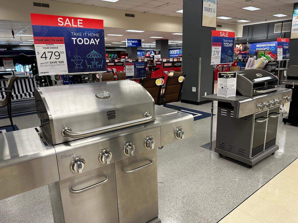 A Kenmore four burner stainless steel gas grill is marked down from $799.99 to $479.99 — a $320 savings off a brand Sears once owned since selling the first Kenmore product in 1913. This grill was on sale at the Sears on the corner of Douglas Road and Coral Way in Miami near Coral Gables on July 10, 2024.