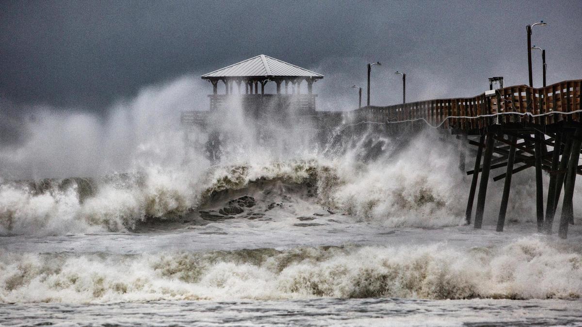 Waves from Hurricane Florence slam the Oceanana Pier & Pier House Restaurant in North Carolina in September.