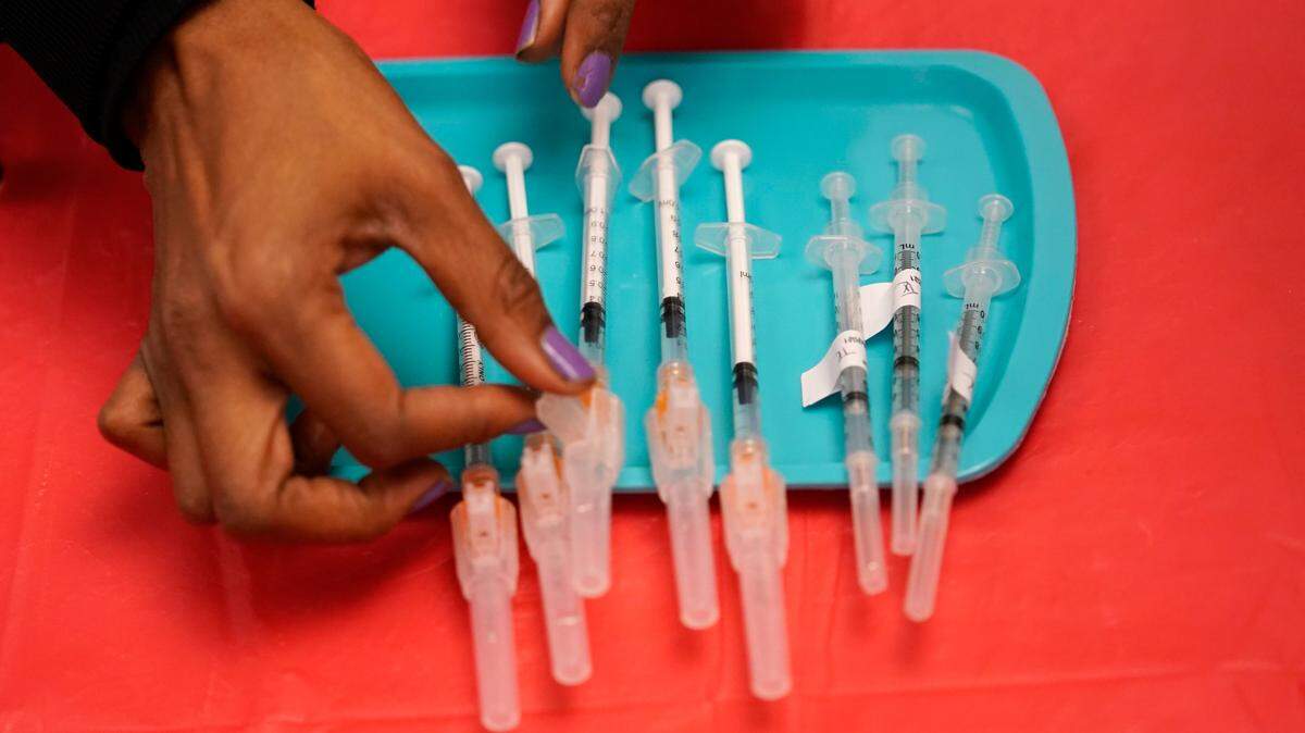 In this Jan. 22, 2021, photo, a certified medical assistant prepares doses of the Pfizer COVID-19 vaccine at a vaccination center at the University of Nevada, Las Vegas.