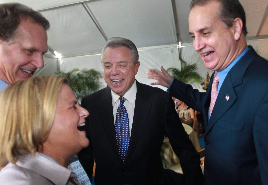 Benjamin Leon Jr. (M) shares a laugh with Lincoln Diaz-Balart-(L), Ileana Ros-Lehtinen and Congressman Mario Diaz-Balart at the unveiling of a sign honoring Leon Jr. September 27, 2012
