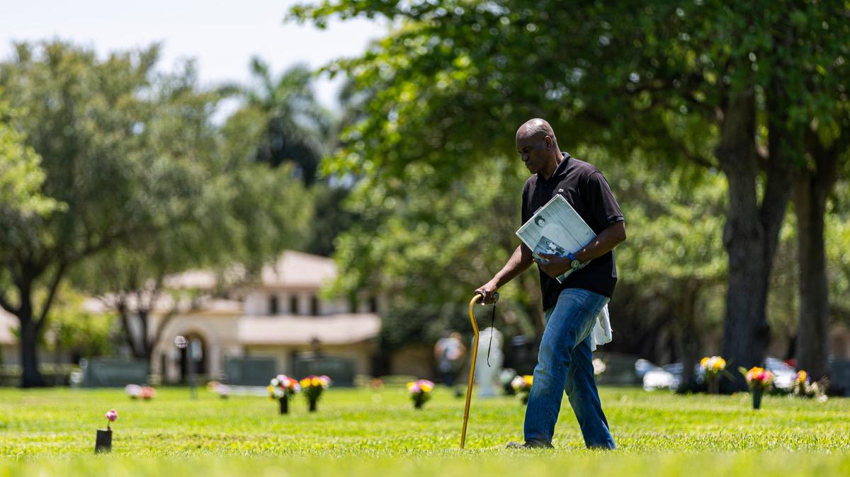 Augustin Lorfils, 53, visits Our Lady of Mercy Catholic Cemetery on Friday, May 10, 2024, in Doral. Lorfils’ mother and five siblings, who died a tragic death, are buried at the cemetery and he is now working to place headstones at their grave site.