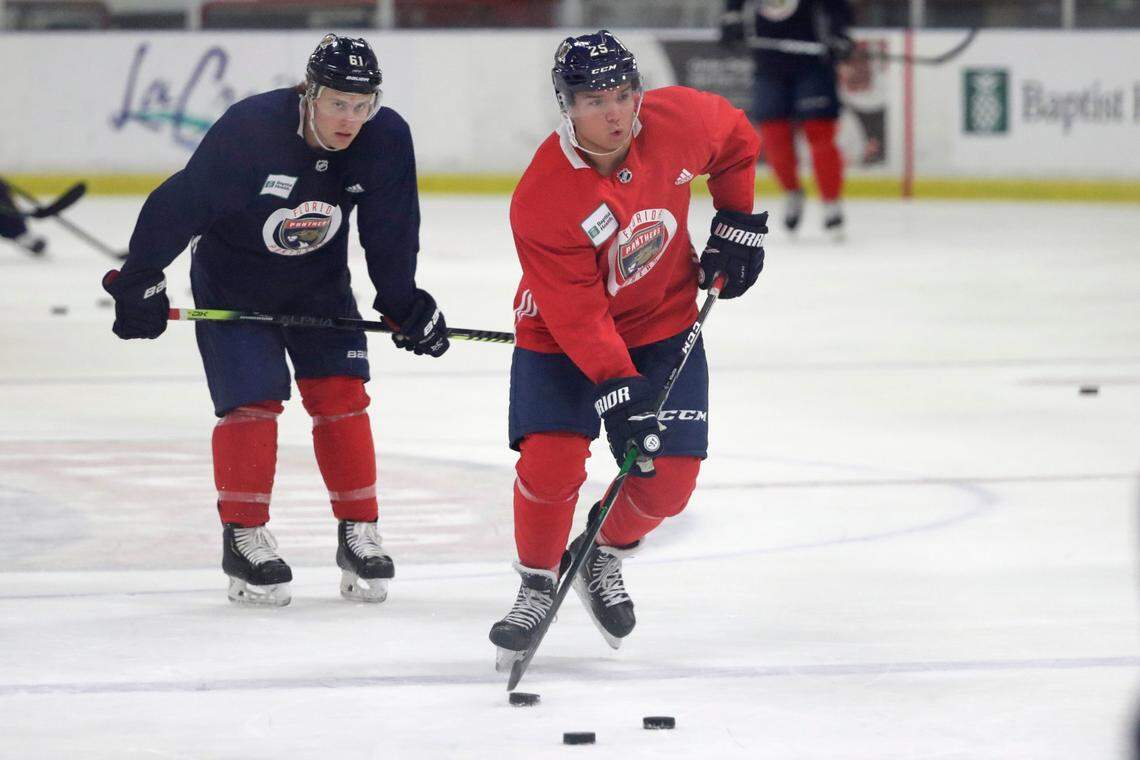 Florida Panthers defensemen Brady Keeper, right, and Riley Stillman run through drills during an NHL hockey training camp, Wednesday, July 22, 2020, at the Panther’s training facility in Coral Springs, Fla. (AP Photo/Wilfredo Lee)