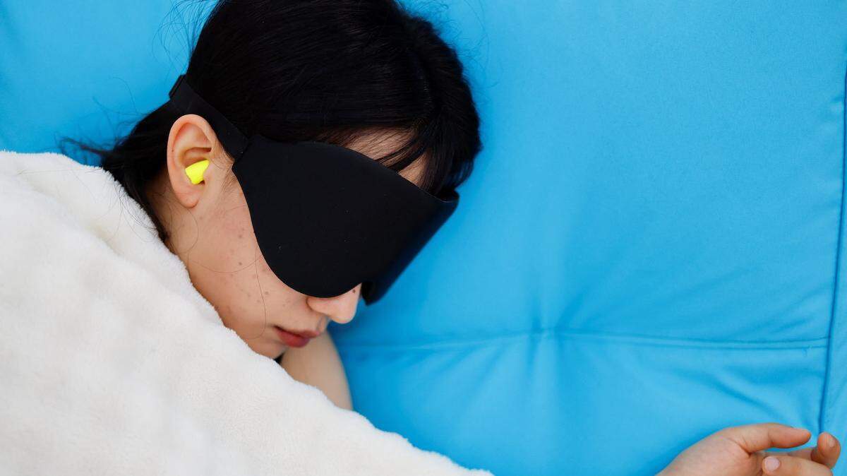 A participant sleeps during the 2026 Power Nap contest at Han River park in Seoul, South Korea, May 2, 2026. REUTERS/Kim Soo-hyeon