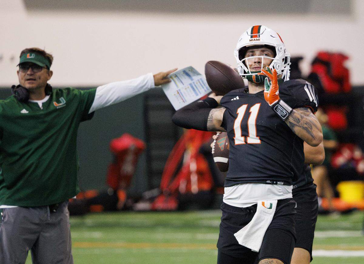 Quarterback Carson Beck (11) throws the ball during Miami Hurricanes football practice on Wednesday, Aug. 6, 2025, at University of Miami in Coral Gables, Fla.