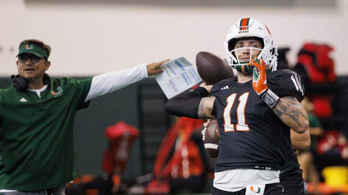 Quarterback Carson Beck (11) throws the ball during Miami Hurricanes football practice on Wednesday, Aug. 6, 2025, at University of Miami in Coral Gables, Fla.