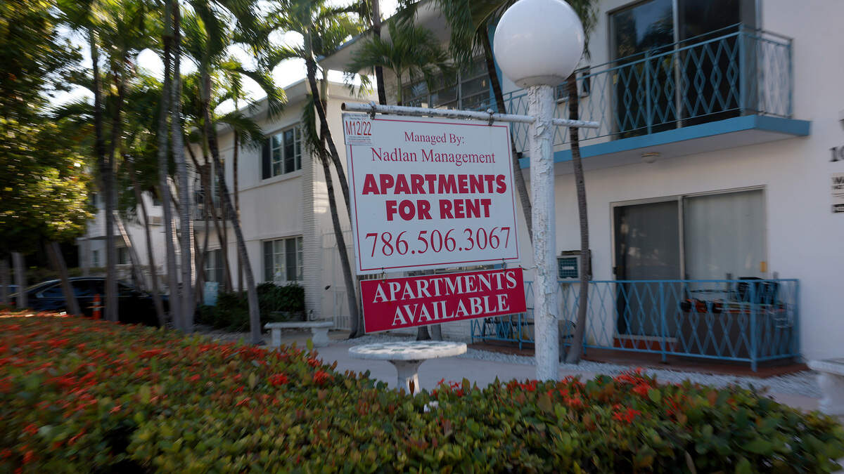 An “Apartments for rent” sign hangs in front of a building in Miami Beach, Florida.