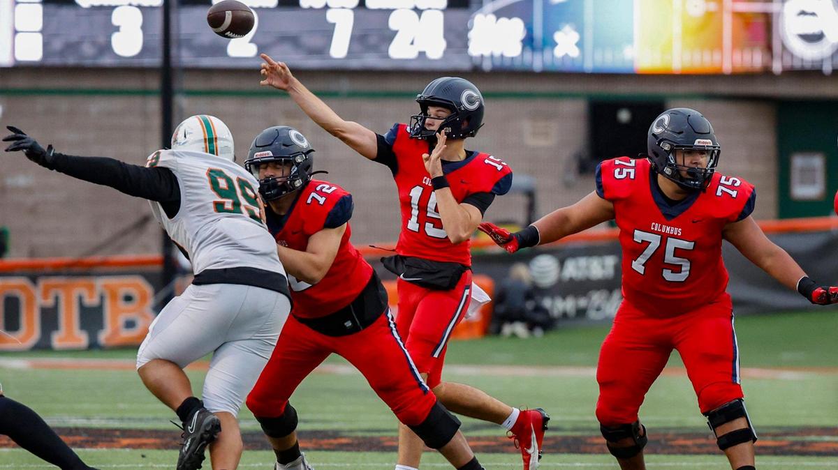 Columbus Explorers quarterback Alberto Mendoza (15) throws the ball during the game against the Mandarin Mustangs in the first half of the Class 4M state championship game at Bragg Memorial Stadium in Tallahassee, Florida, on Friday, December 8, 2023.