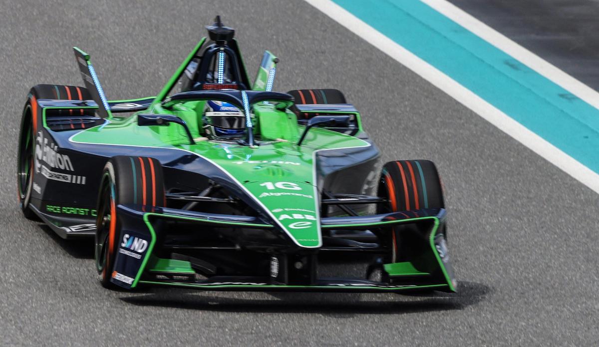 Tom Felton takes to the track as he speeds down the straightaway while test driving Envision’s electric race car on Wednesday, March 6, 2025.