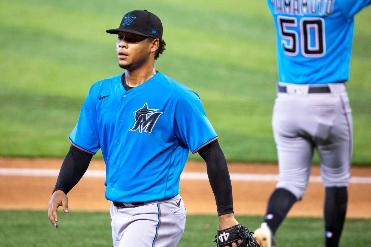Marlins right-handed pitcher Elieser Hernández (57) comes off the mound for Jordan Yamamoto (50) during a intra squad simulated game at Marlins Park in Miami, Florida on Sunday, July 12, 2020.