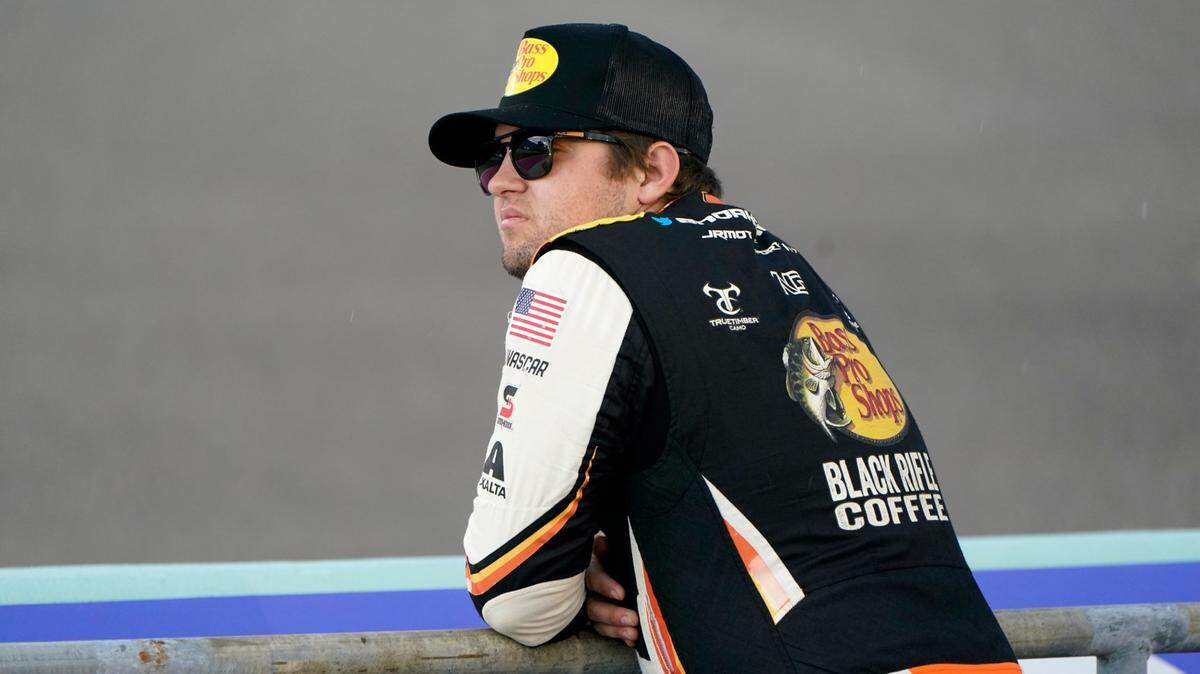Noah Gragson looks out onto the track before a NASCAR Xfinity Series auto racing practice session at Homestead-Miami Speedway, Friday, Oct. 21, 2022, in Homestead, Fla. (AP Photo/Lynne Sladky)