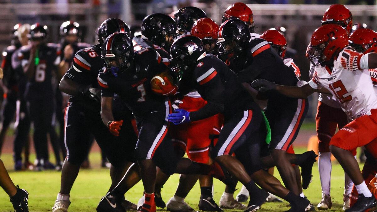 Southridge Spartans middle linebacker Joshua Mcdowell (1) runs with the football for a touchdown against the Monarch Knights during the second quarter of a high school football playoff game at Southridge Park in Miami, Florida, on Friday, November 22, 2024.