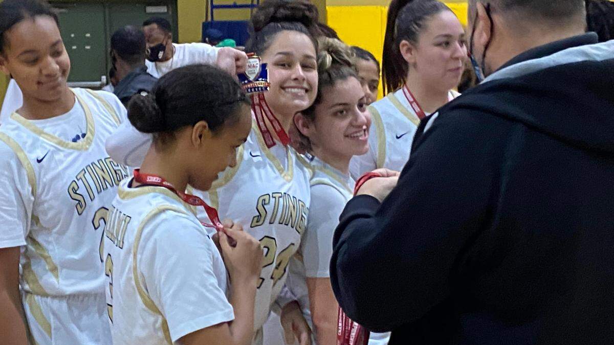 Miami High guard Cameron Araujo celebrates with her teammates after the Stingarees cruised to a 49-20 victory over Norland on Thursday night, which clinched the GMAC girls’ basketball championship.