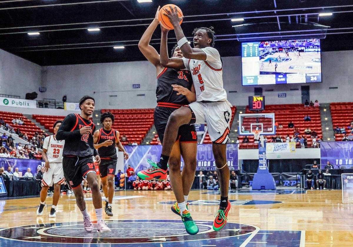 Sagemont’s Patrick Liburd (5) attempts to score as Victory Christian Academy’s MJ McCalla (32) defends in the first half during boy’s 1A basketball State Final of the Florida High School State Championships at the RP Funding Center in Lakeland, Florida on Thursday, February 27, 2025.