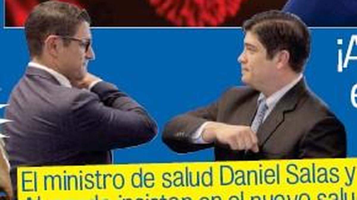 Costa Rican President Carlos Alvarado, right, and health minister, Daniel Salas, demonstrate a safety-conscious elbow greeting early in the coronavirus pandemic.