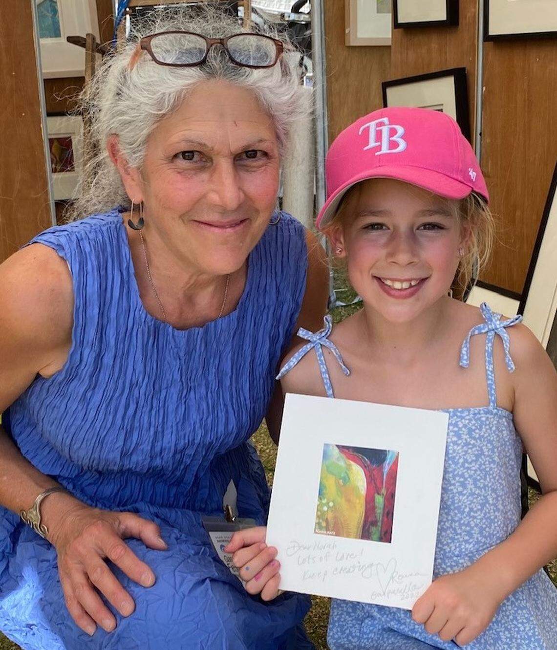 Artist Ronna Katz with one of her young customers. Buying their own art ‘resonates’ with them, she says.