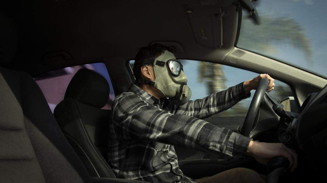 A driver exercises extreme caution in his car following a University of California, Riverside study that found the majority of Californians who regularly travel by car inhale dangerous levels of carcinogens floating inside their vehicles that exceed thresholds for exposure.
